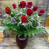 Short Stem Red Roses in Coloured Glass Vase